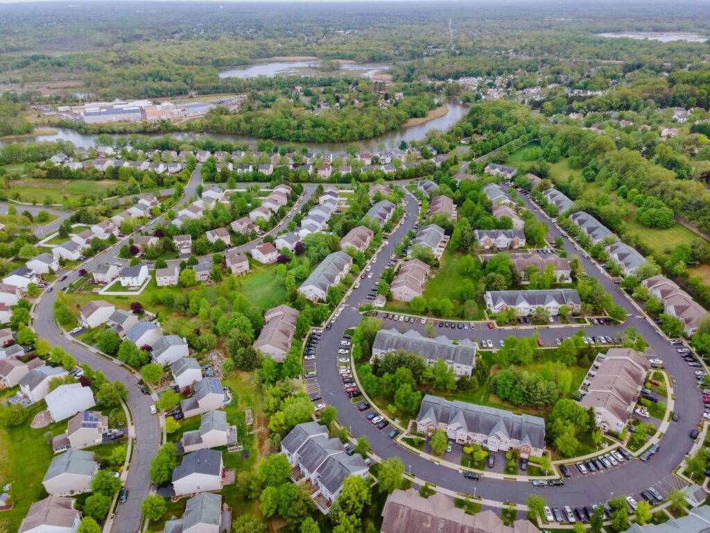 Aerial top view of small town urban landscape roofs of neighborhood with houses